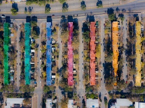 Aerial shot of colorful rooftops in an urban residential area, showcasing vibrant community design.